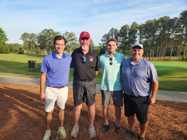2023 Golf Scramble winners  Patrick Foster, Leonard Nelms, Jay Lawrence, and Michael Lawrence pose at the UGA Golf Course