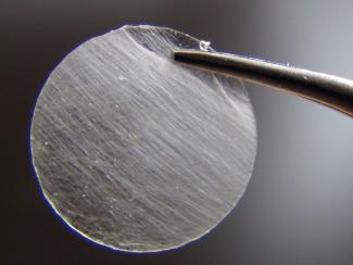 Detail of a nanofiber spool produced by an ultra-fast, touch-spinning technology which can produce thousands of yards of nanofibers in a matter of minutes.