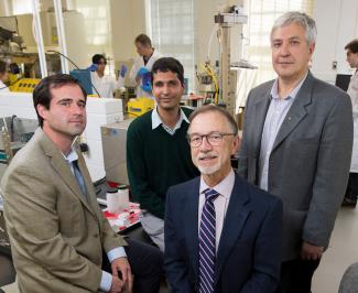 The Chemistry department's Sergiy Minko and Jason Rocklin, along with Suraj Sharma of the College of Family and Consumer Sciences, stand together in a lab.