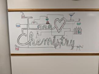 Image of a whiteboard with a drawing that says "I love Chemistry"