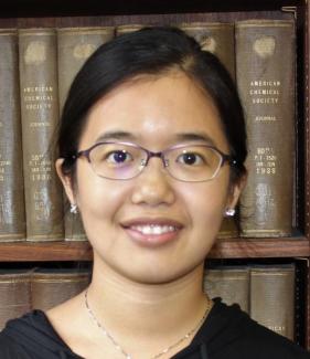 Headshot of Yi Liu, Asian woman with black hair and glasses