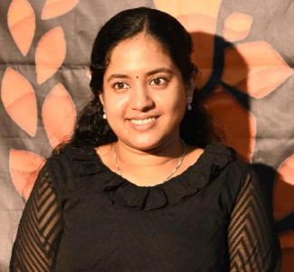 Portrait of Akhila Madayambath, speaker