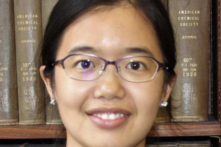 Headshot of Yi Liu, Asian woman with black hair and glasses